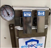 A close up of the water dispenser with a thermometer